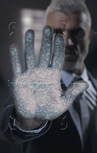 A man in a suit holds out a digitised hand in a GPS-based outdoor escape room.